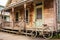 antique bicycle in front of historic wooden building