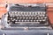 Antique black typewriter metal with rusty and dust on wood table background