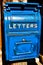 Antique Blue Letter Box on the Telegraph made of wood