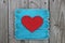 Antique blue sign with large red heart