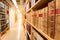 Antique books on wooden bookshelf in library