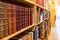 Antique books on wooden bookshelf in library