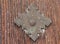 Antique brass door ornament with wood background