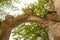 Antique brick arch with patterns over the entrance closeup. Old red brick masonry. Made at the beginning of the last century.