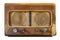 Antique broadcast radio receiver isolated from white background.