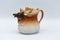 Antique brown and white coffee creamer with moose head and antlers