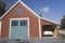 An antique car parked in a barn garage