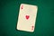 Antique card on green casino table