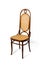 Antique chair on white background. Beech bentwood furniture with caned seat and backrest. Michael Thonet chair number 17 made of