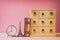 antique chest with drawers next to old book and eiffel tower