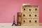 antique chest with drawers next to old book and eiffel tower