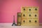antique chest with drawers next to old book and eiffel tower