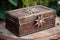 antique cigar box with intricate metal clasp