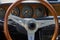 Antique classic wood steering wheel and dashboard in German vintage car