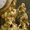 Antique clock detail with carved wood figural decoration