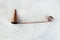 Antique copper candle snuffer on concrete background