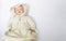 Antique Doll in Knit Sweater with Cameo on White Background