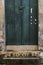 Antique door details in color with shadow, iron, cement, wood