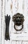 antique door handle in the form of a lion on a white wooden door, close-up