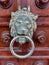 Antique door knocker in the form of a lion`s head