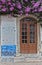 Antique Door near Purple Flowers in the Medieval Portuguese City