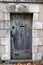 Antique door on a stone faÃ§ade