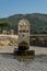 Antique drinking fountain with eagle carved in stone in Tivoli, Italy