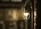 Antique electronic lamp, hanging at the red brick wall in the building.soft focus