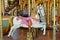 Antique fairground carousel with prominent horse