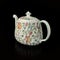 Antique figured teapot with hand painting.