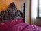 Antique four-poster bed with headboards carved inside Villa dei