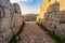 Antique gate in the end of road in ancient rome or greece. Sicily