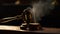 Antique gavel on dark wood table symbolizes justice in law generated by AI