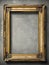 Antique golden art fair gallery frame with metal decorations and blank copy space