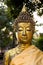 Antique golden Buddha Wat Chet Yot Thailand afternoon sun