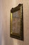 Antique golden frame on a wall