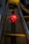 Antique grand piano mechanics detail with a red carnation flower