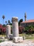 Antique greek columns and minaret of the mosque