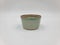 Antique green pottery Sake cup in white background for decoration and collectible