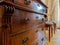 Antique handmade wooden wardrobe. Wood carving. Classic furniture in the interior