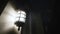 Antique illuminated street lantern at night on the wall