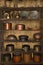 Antique Indian kitchenware collection on wooden shelf, Metal utensils ,pans, containers ,pots, kadhai made of copper, brass, and