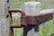Antique iron hinges on the gate at the entrance to the ranch