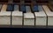 Antique Ivory Piano Keys Forgotten dramatically symbolize an age gone and music once heard in music halls 