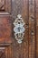 Antique keyhole on old paneled wooden door