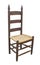 Antique ladder back chair isolated.