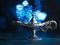 Antique lamp. Fairy lamp of Aladdin granting wishes on a blue background. Antique item adorned with precious stones. There are no