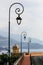 Antique lamp posts along a street with sea view in Monaco