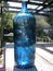 Antique large blue apothecary bottle in natural sunlight