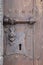 Antique large castle on an oak wrought-iron door to the castle